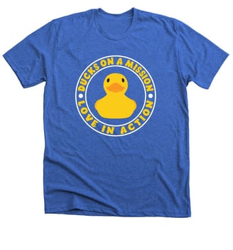 a blue t - shirt with a ducky in the middle of it