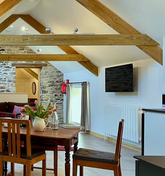 a dining room with a table and chairs