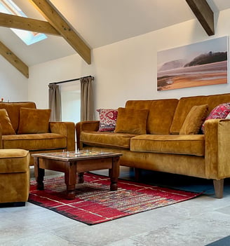 a living room with a couch and a table