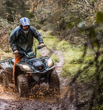 a man riding a four wheeler atv