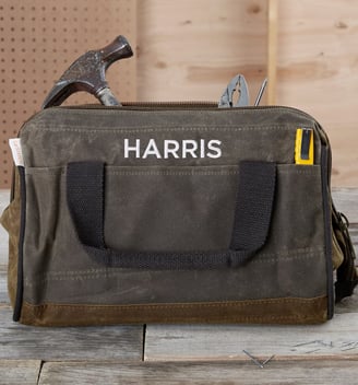 a tool bag with a hammer