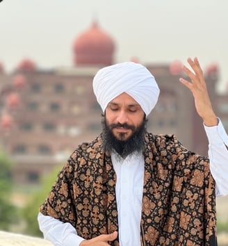 a man in a turban and a woman in a white shirt