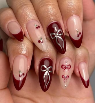 Uñas rojas con moños