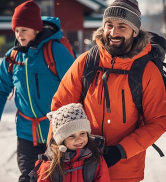 a father and daughter setting out for a day of skiing close to their Holiday Club spa hotel