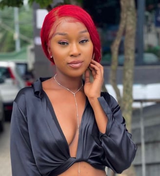Efia Odo in a blue shirt.