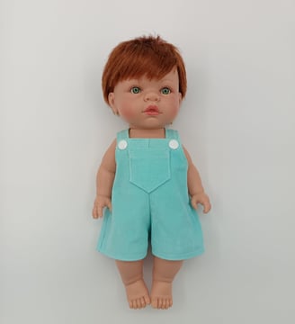 Lille Love doll dressed in blue short dungarees made for Minikane doll