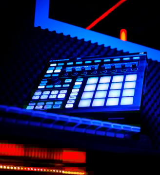 a dj controller controller and a keyboard in a recording studio