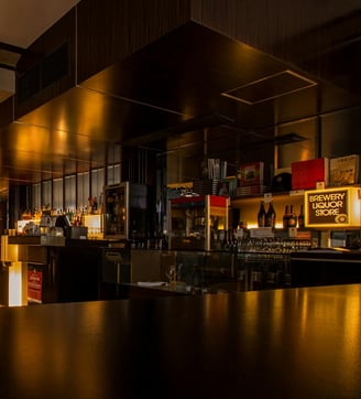 Interior of a modern restaurant and bar for sale, showcasing prime commercial real estate.