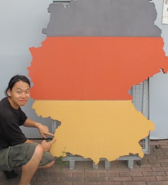 a man is holding a map of germany