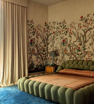 green bed frame with linen curtains and a blue rug