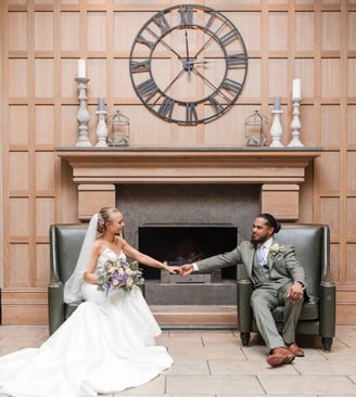 Newly weds hold hands in a beautiful wedding portrait