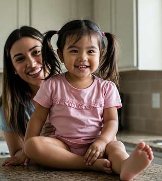 mother with child on cabinet in kitchen