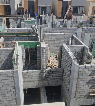 a building being built into a house with a concrete structure