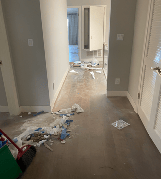 a room with a dirty wood floor