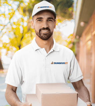 a man in a white shirt is holding a box of pizza