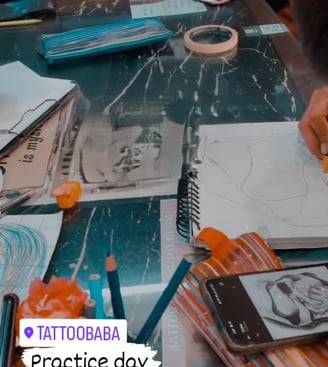 A close-up of a detailed tattoo being inked at Tattoo Baba, showcasing the artist's precision and sk