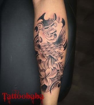 A close-up of a detailed tattoo being inked at Tattoo Baba, showcasing the artist's precision and sk