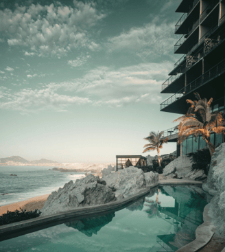 a pool with a view of a beach
