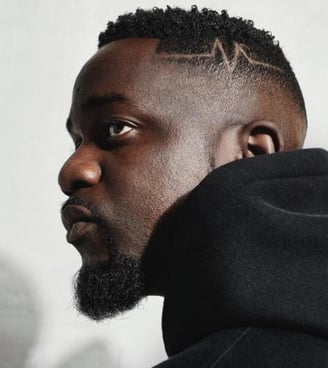 Sarkodie in a black sweater.