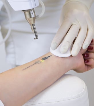 A close-up of a detailed tattoo being inked at Tattoo Baba, showcasing the artist's precision and sk