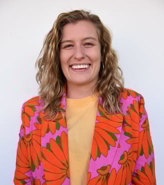 Portrait of psychologist Ingrid wearing a bright blazer