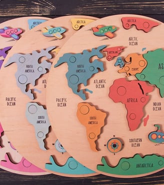 a wooden puzzle puzzle board with a map of the world