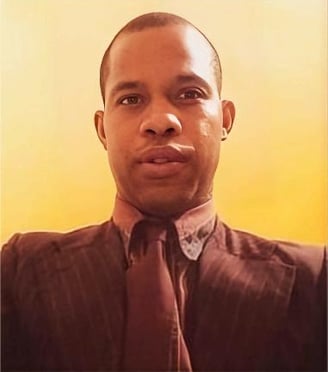 a man in a suit and tie with a tie