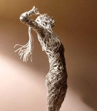 A cotton-covered wire sculpture of a standing female figure stretching with arms raised