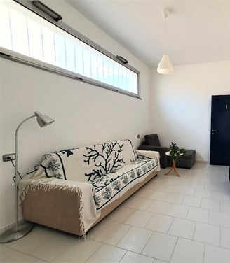a couch with a tv and a television