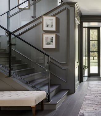 a hallway with a bench and a bench in the middle of the room