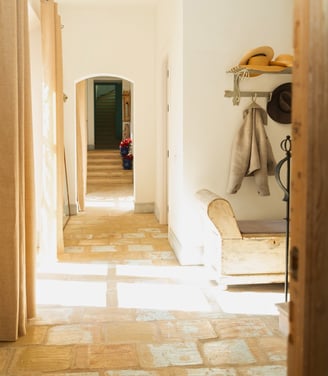 Charming hallway with a coat hanger and bench at Finca Santa Katerina