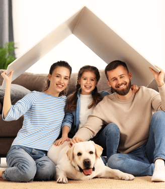 a family of four sitting on a couch in a living room