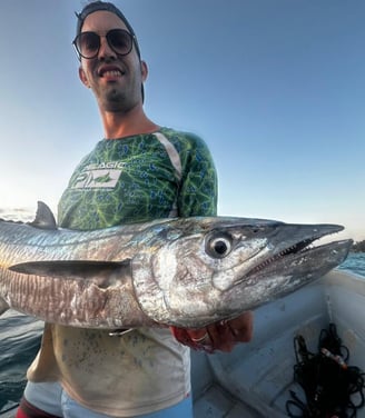 Proud angler with a King Fish caught during a Half-Day Fishing Charter in Zanzibar