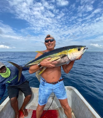 Anglers celebrating a successful yellowfin tuna catch in Makunduchi.