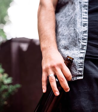 man holding a beer bottle, under the influence of Alcohol