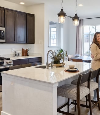 Family reviewing purchase agreement in Harvest Ridge living room