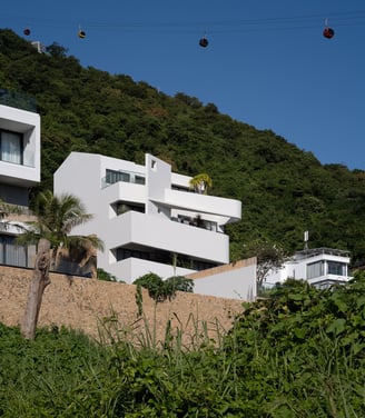 a house with a cable car going up a hill