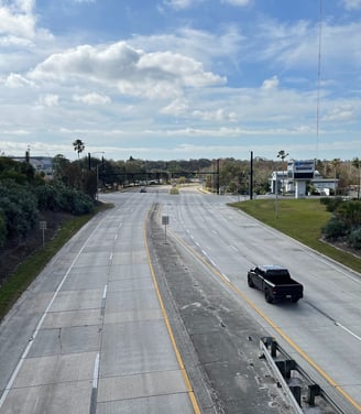 a truck driving down a highway 