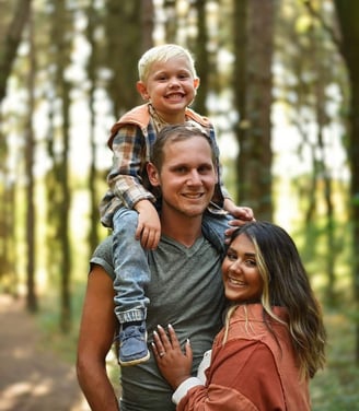 The Woltjer family with beautiful wooded scenery