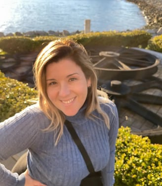 Doula Fabiola in a blue sweater and black pants