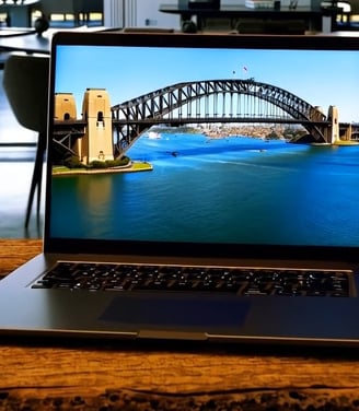 A laptop open on a rustic table the Sydney Harbour Bridge is on the screen