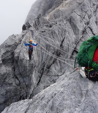 Crossing Tyrolean for Summit Carstensz Pyramide