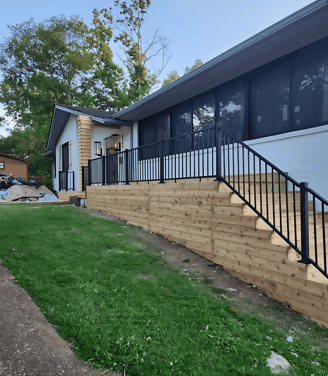 a house with a fenced in area decks, porch
