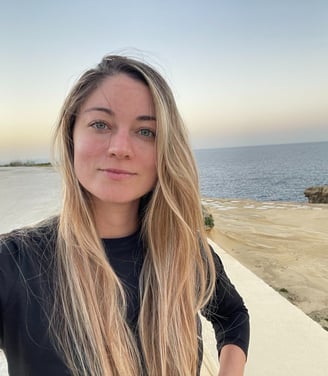 A portrait of Christy doing one of her favourite activities: walking near the beach.
