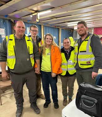 a group of people standing in a room
