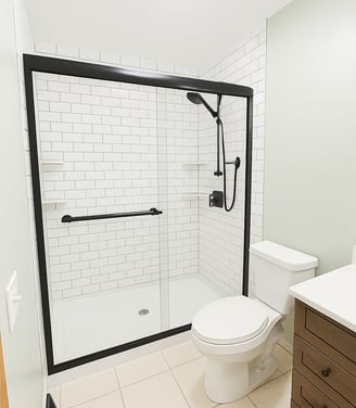 a bathroom with a toilet and a shower