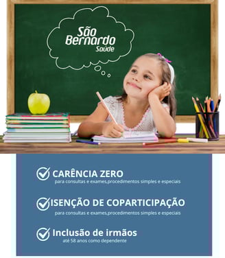 a girl sitting at a desk with a green chalkboard