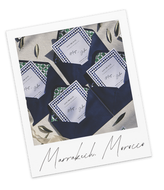 several opened wedding invitations with the invitation inside the open envelope