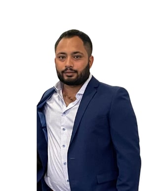 a man in a suit and tie standing in front of a white background