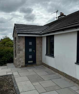 a house with a black door and a black door